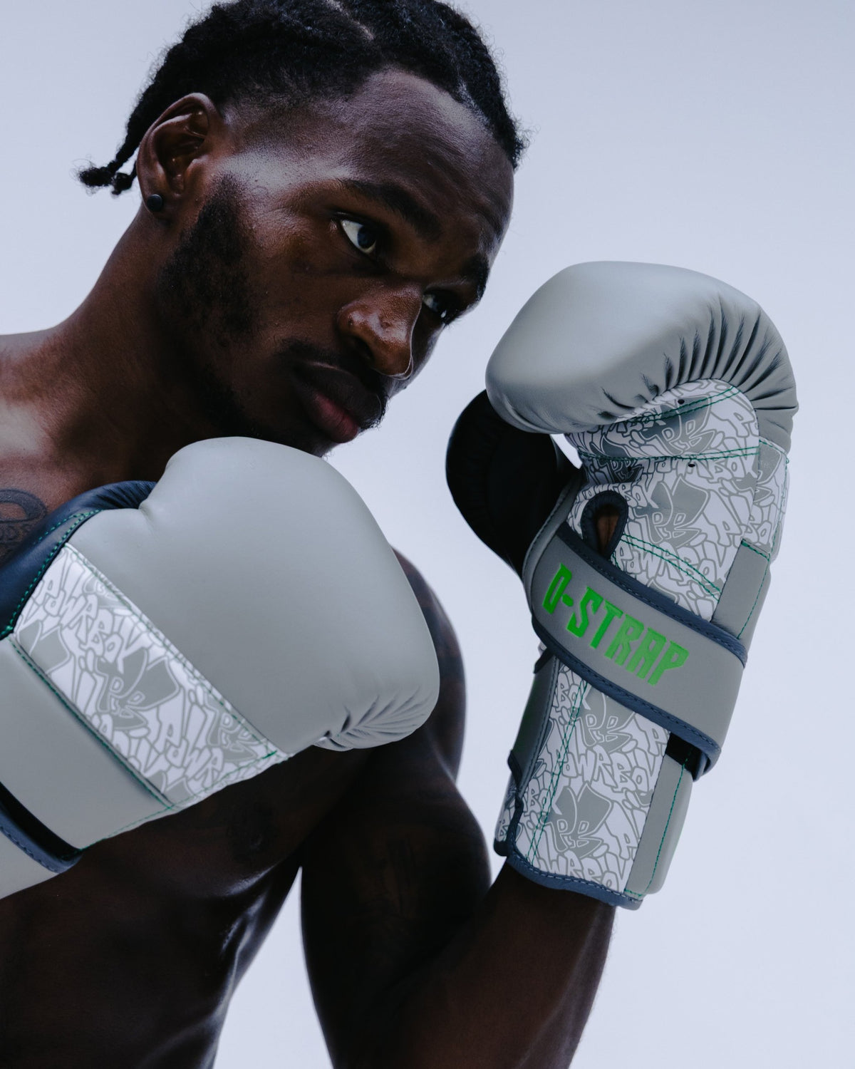 Boxer wearing Powrbox D-Strap Double Velcro Gloves in Public Koncrete matte grey, white and green