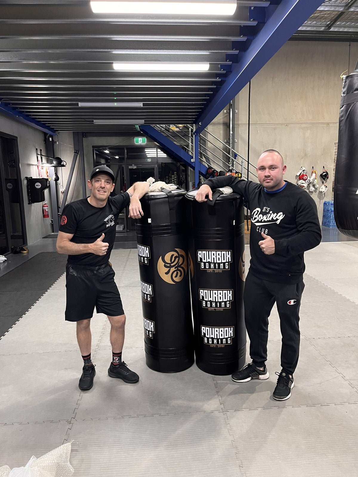 Bryce delivering Powrbox heavy bags to Gav Snape at Northend Boxing Club, Penrith