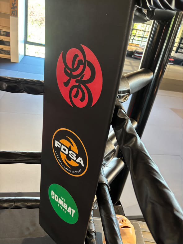 Powrbox and FDSA logos on a custom boxing ring corner pad